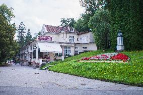 the Theatre Cafe and Restaurant, bust of Leos Janacek, ornamental flower bed writing Lazne Luhacovice 2020 (Luhacovice Spa 2020)