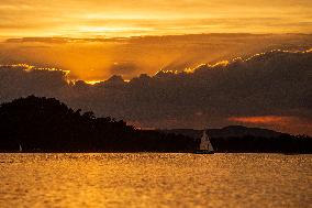 sunset over Lake Macha, sailing boat, water surface