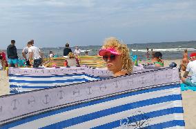 Stylish lady on the beach in the Katy Rybackie village at the Baltic sea coast