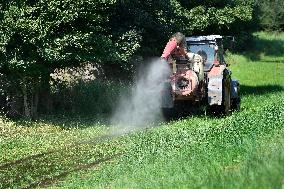 foresters spray against mosquitoes in flooded meadows behind the Pohansko chateau, tractor, spray, spraying