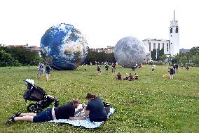 giant inflatable model of the Moon and the planet Earth