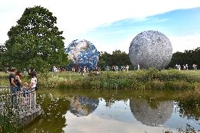 giant inflatable model of the Moon and the planet Earth