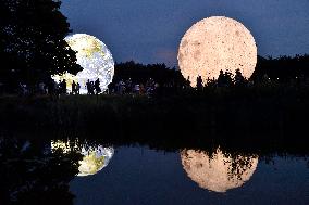 giant inflatable model of the Moon and the planet Earth