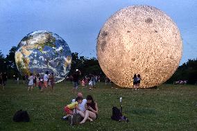 giant inflatable model of the Moon and the planet Earth