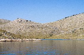 Kornati Islands National Park, The Kornati archipelago, stone cross, crosses, memorial to firefighters