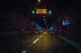 tunnel, SOS sign, point, notice board DRZITE RAZMAK, KEEP DISTANCE, ABSTAND HALTEN, A1 motorway direction from the coastline, highway, low traffic, rideable, almost empty
