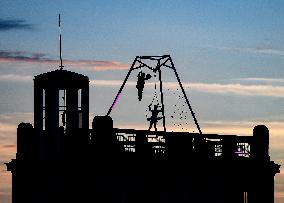 filming of Andersen's fairy tale The Shepherdess and the Chimney Sweep on the roofs of the Lucerna Palace in Prague, acrobatics