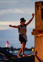 filming of Andersen's fairy tale The Shepherdess and the Chimney Sweep on the roofs of the Lucerna Palace in Prague, acrobatics