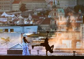 filming of Andersen's fairy tale The Shepherdess and the Chimney Sweep on the roofs of the Lucerna Palace in Prague, acrobatics