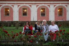 Castle Bonfire Night at Mnichovo Hradiste chateau, park, bench, women