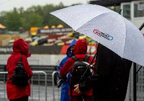 Heavy rain, second day of European Truck Racing Championship event, Most, umbrella, MOST AUTODROM