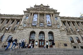 People stand a queue in front of the historical building of National Museum