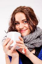 A beautiful young woman, lady, girl, cold, runny nose, headache, cup of tea, scarf, hot drink