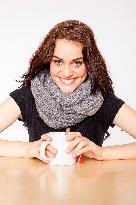 A beautiful young woman, lady, girl, cold, runny nose, headache, cup of tea, scarf, hot drink