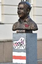 Belarus historical flag on the bust of late Czech President Vaclav Havel