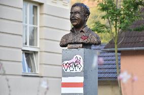 Belarus historical flag on the bust of late Czech President Vaclav Havel