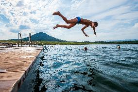 Lake Most, Czech Republic, people, visitors, nice weather, swimming, jump, water