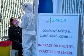 Medic in a protective suit, sample for a covid-19, testing,  test Zlute lazne, Prague