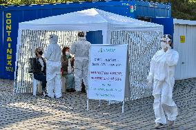 Medic in a protective suit, sample for a covid-19, testing,  test Zlute lazne, Prague