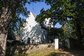 The Church of Saint Maurice, Mourenec, graveyard