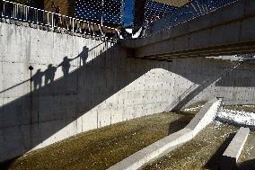 draining of water over the overflow and slope of the Sance dam