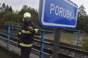 River Porubka, village Vresina, heavy rain, raised water level, fireman