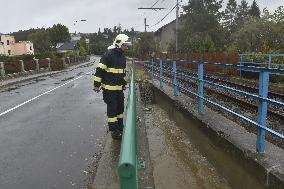 River Porubka, village Vresina, heavy rain, raised water level, fireman