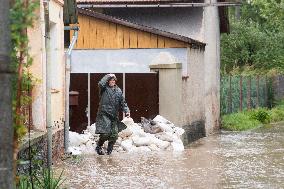 River Novohradka, village Luze, heavy rain, raised water level