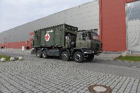 Military convoy with equipment for field hospital, container