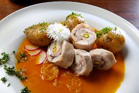 Turkey Roulade with roasted onion,  sauce, potatoes