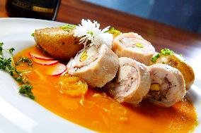 Turkey Roulade with roasted onion,  sauce, potatoes