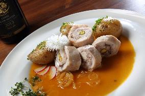 Turkey Roulade with roasted onion,  sauce, potatoes