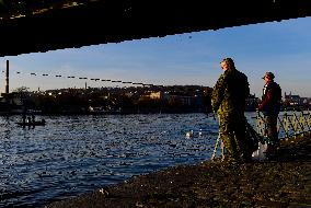 People, city center, Prague, Vltava River, fisherman