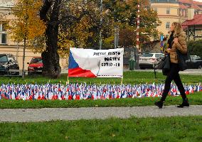 Covid-19, coronavirus memorial, Czech flags, park, Prague