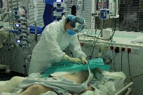 University Hospital Kralovske Vinohrady, department of anesthesiology and resuscitation for patients with COVID-19 disease, medical staff, protective clothing, suit, healthcare professionals, breathing mask, filter