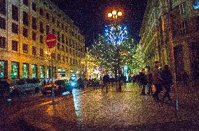 people stroll the Christmas decorated Na Prikope Street