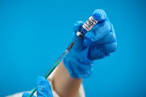 Vaccine, vaccination, covid-19, coronavirus, vaccine syringe, injection, application, gloves, mask, protective clothing