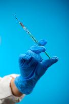 Vaccine, vaccination, covid-19, coronavirus, vaccine syringe, injection, application, gloves, mask, protective clothing