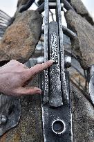 A five-metre stone and stainless steel statue of a carp, fish