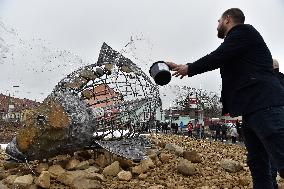 A five-metre stone and stainless steel statue of a carp, fish