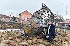 A five-metre stone and stainless steel statue of a carp, fish