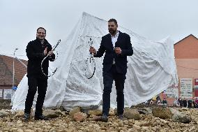 A five-metre stone and stainless steel statue of a carp, fish