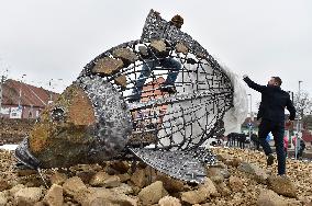 A five-metre stone and stainless steel statue of a carp, fish