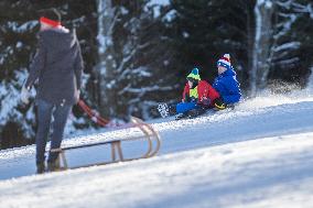 People, children, sun weather, snow, mountain, ski-areal Kobyla, Zadov