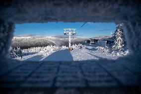 People, children, sun weather, snow, mountain, ski-areal Svaty Petr, Spindleruv Mlyn, closed lift