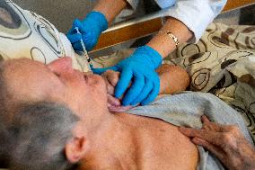 Vaccination against coronavirus, Czech Republic, syringe, senior