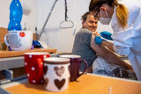 Vaccination against coronavirus, Czech Republic, syringe, senior