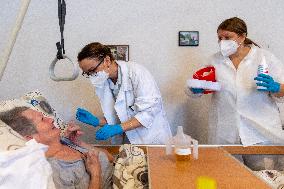 Vaccination against coronavirus, Czech Republic, syringe, senior