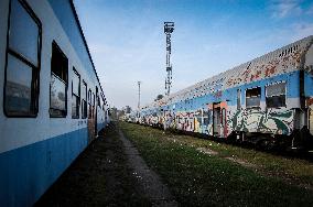Electric train, disposal, locomotive, railway, graffiti.