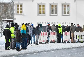 queue of commuters waiting for mandatory coronavirus tests in Bayerisch Eisenstein